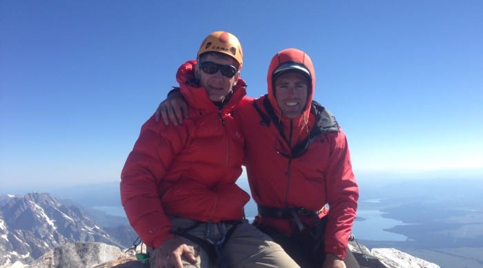 Two male rock climbers on the summit of the Grand Teton.