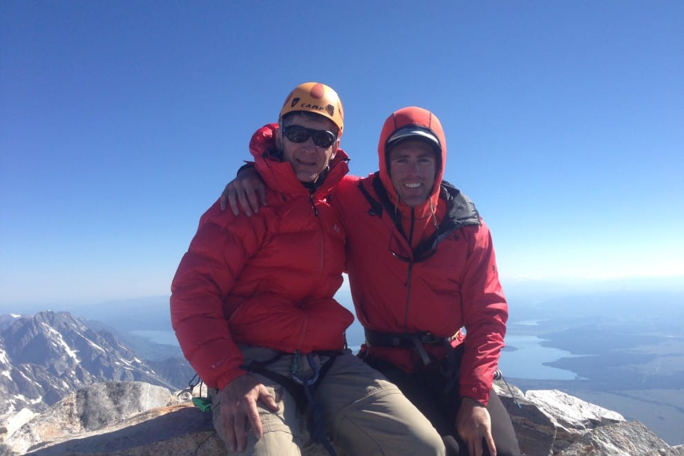Two male rock climbers on the summit of the Grand Teton.