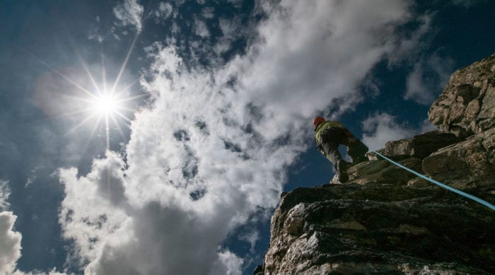 Rock climber lead climbs on the Grand Teton.