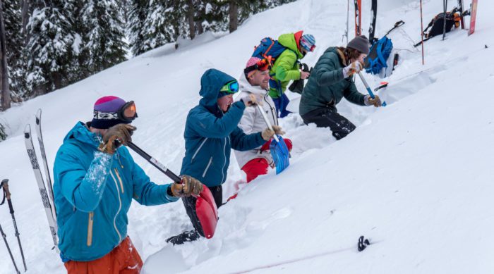 Avalanche education students dig a snow pit.