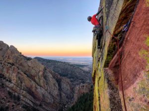 Trad climber on lead in Eldorado Canyon, Colorado.