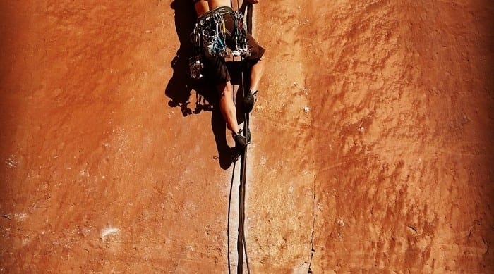 women crack climbing in moab