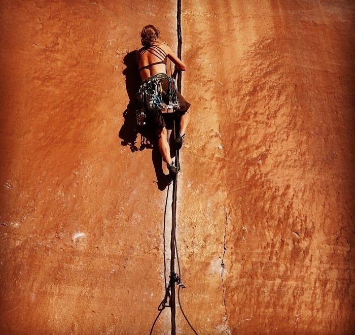 women crack climbing in moab