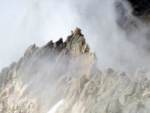 a climber near the summit of a mountain