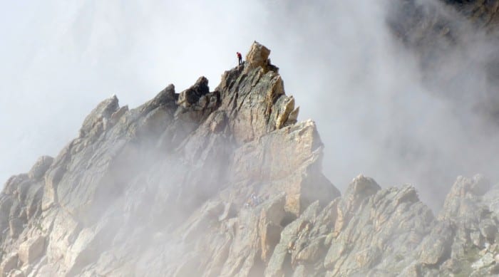 a climber near the summit of a mountain