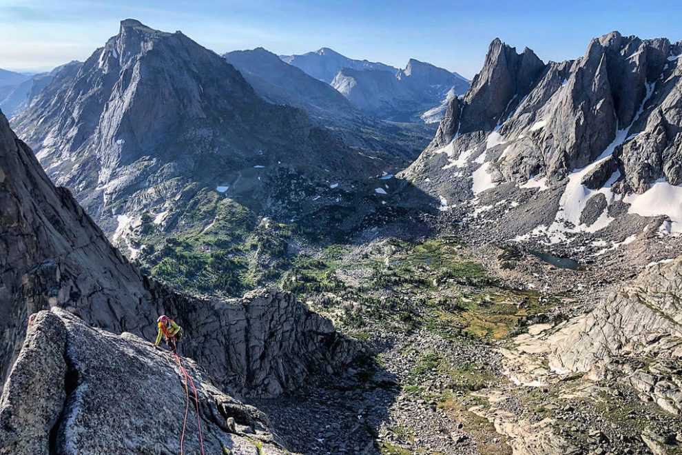 Rock climber in the Wind River Mountain Range on a sunny summer day.
