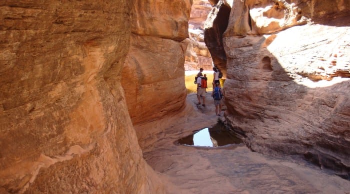 a family taking in the views at one of utah's famous slot canyon