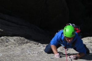 male rock climbing in colorado