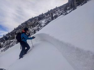 Avalanche educator teaches under an avalanche crown in Rocky Mountain National Park.