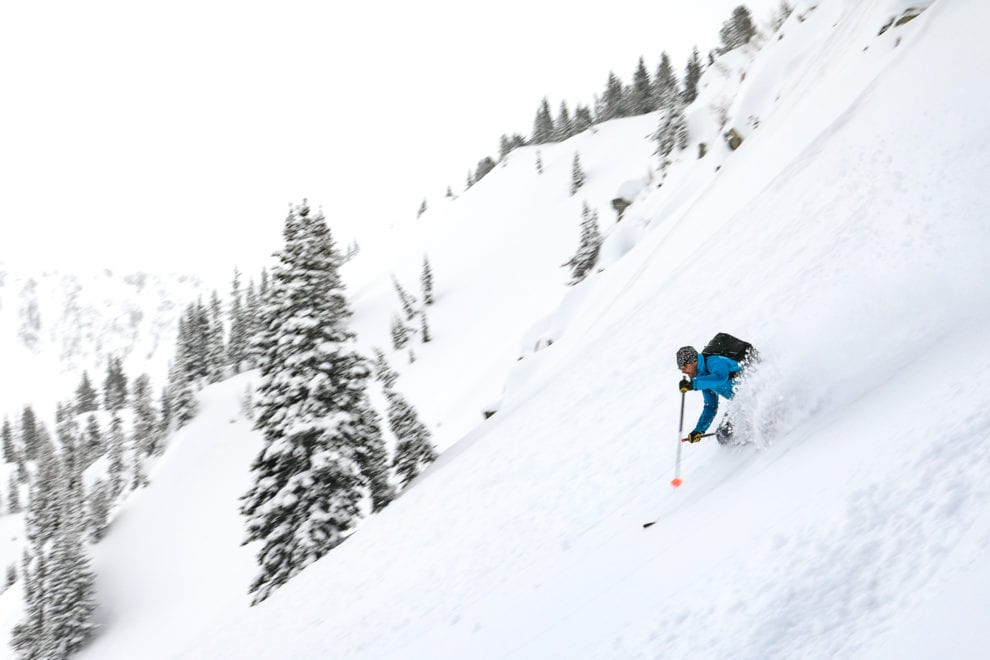 backcountry skier taking waist deep turns