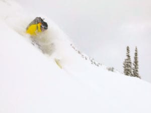 faceshots while snowboarding in backcountry