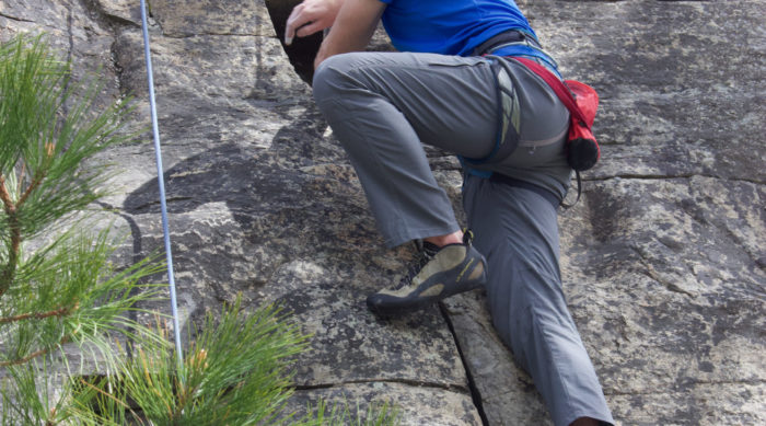 a happy climber looks back at his guide