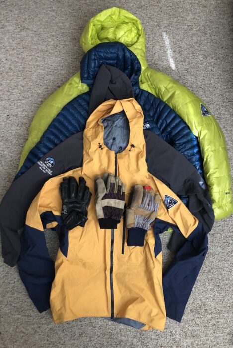 Four ski mountaineering jackets and three pairs of gloves
